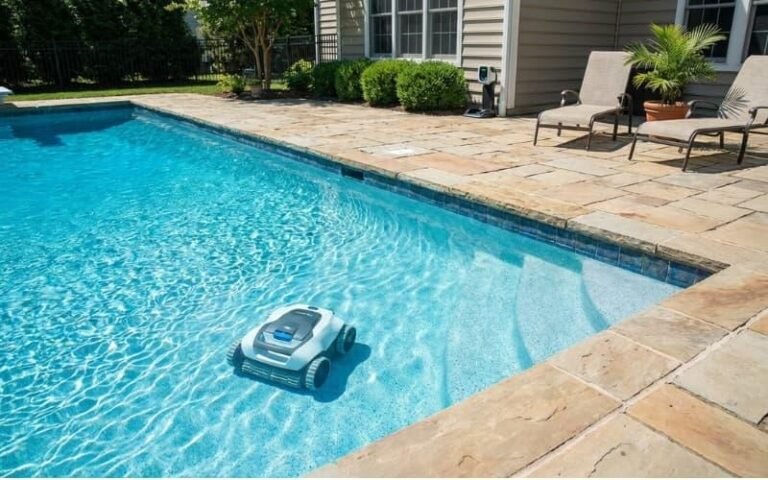 A battery-powered robotic pool cleaner working in a cable-free residential pool environment